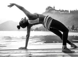 10 Ways Yoga Leads To More Satisfying Sex Black and white photo of woman in wild thing backbend yoga pose on wooden lake dock