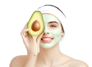 Avocado Mask Recipes Fresh organic avocados and ceramic bowl of homemade avocado facial mask
