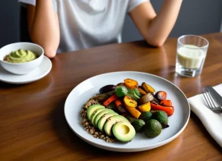 An Approachable Guide to Intermittent Fasting: What the Research Actually Shows Balanced wholesome meal on plate next to subtle clock on clean dining table