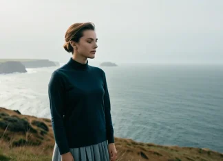 Psychology Explains 5 Techniques to Let Go of Control Person on coastal overlook releasing tension and gazing over serene sea