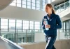 How to Get in Shape Without the Gym: The Science of NEAT Active person incorporating everyday movement on sunlit stairs for NEAT fitness